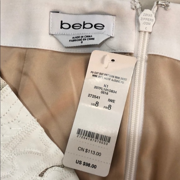 NWT BEBE Women’s White and Tan Cut-Out Patterned Mini Skirt - Picture 3 of 4
